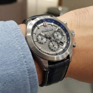 A close-up, high-quality image showcasing a man with a tanned complexion wearing a Pagani watch on his wrist, highlighting its sleek design and functionality.