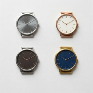 Comparing different plain jane watch styles, showcasing variations in metal and face color.