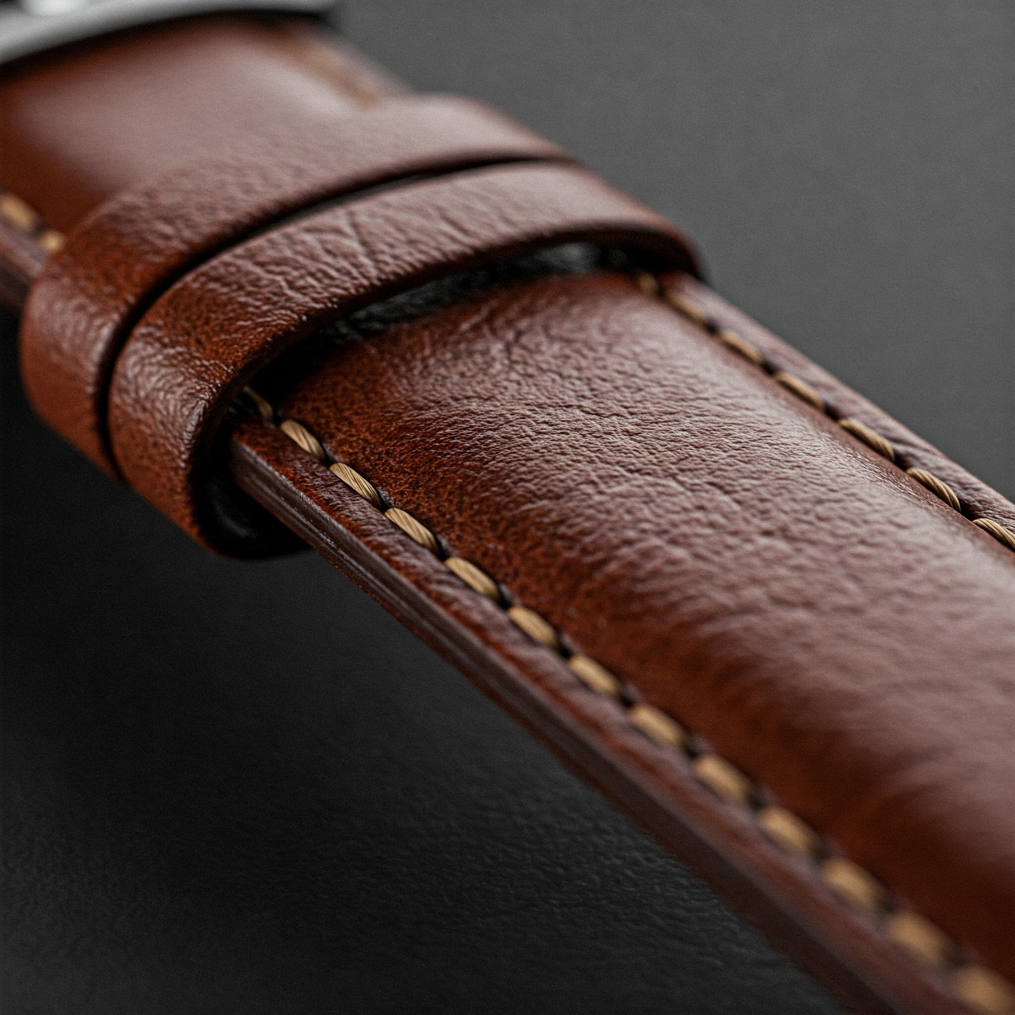 "18mm Watch Band: Close-up of a high-quality brown leather watch band showing the texture and stitching."