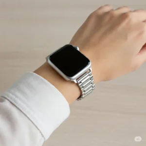 "A silver apple watch band elegantly displayed on a person's wrist, highlighting its fit and comfort."