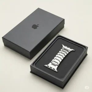 "Elegant packaging of a new silver apple watch band, ideal for gifting."