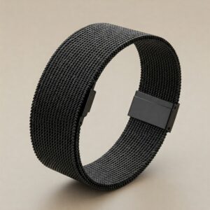 A sleek black milanese watch band on a wrist, demonstrating its comfortable and adjustable fit.