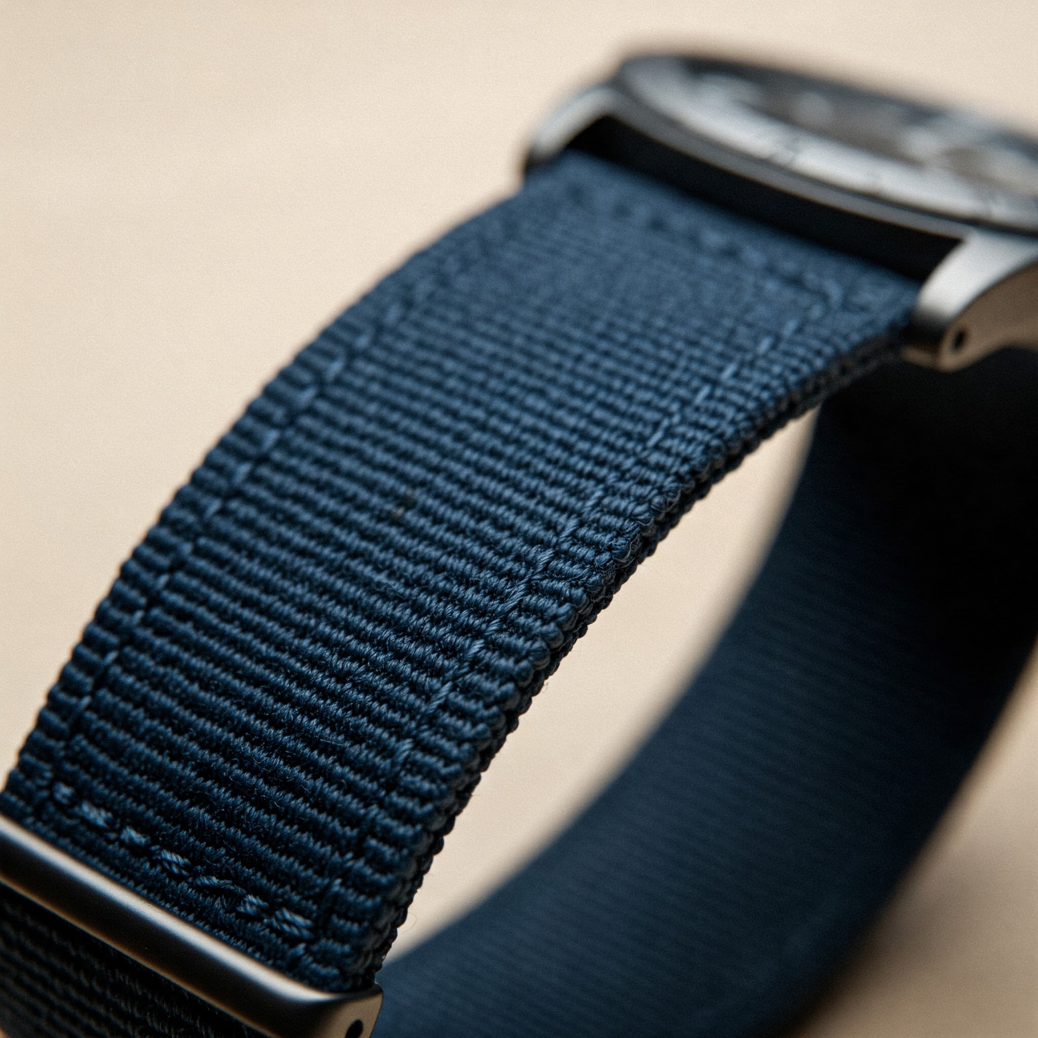 Close-up of a durable canvas watch strap showing its texture and design.