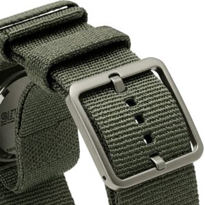 "Detailed view of the buckle and adjustment holes of a perlon watch strap." 