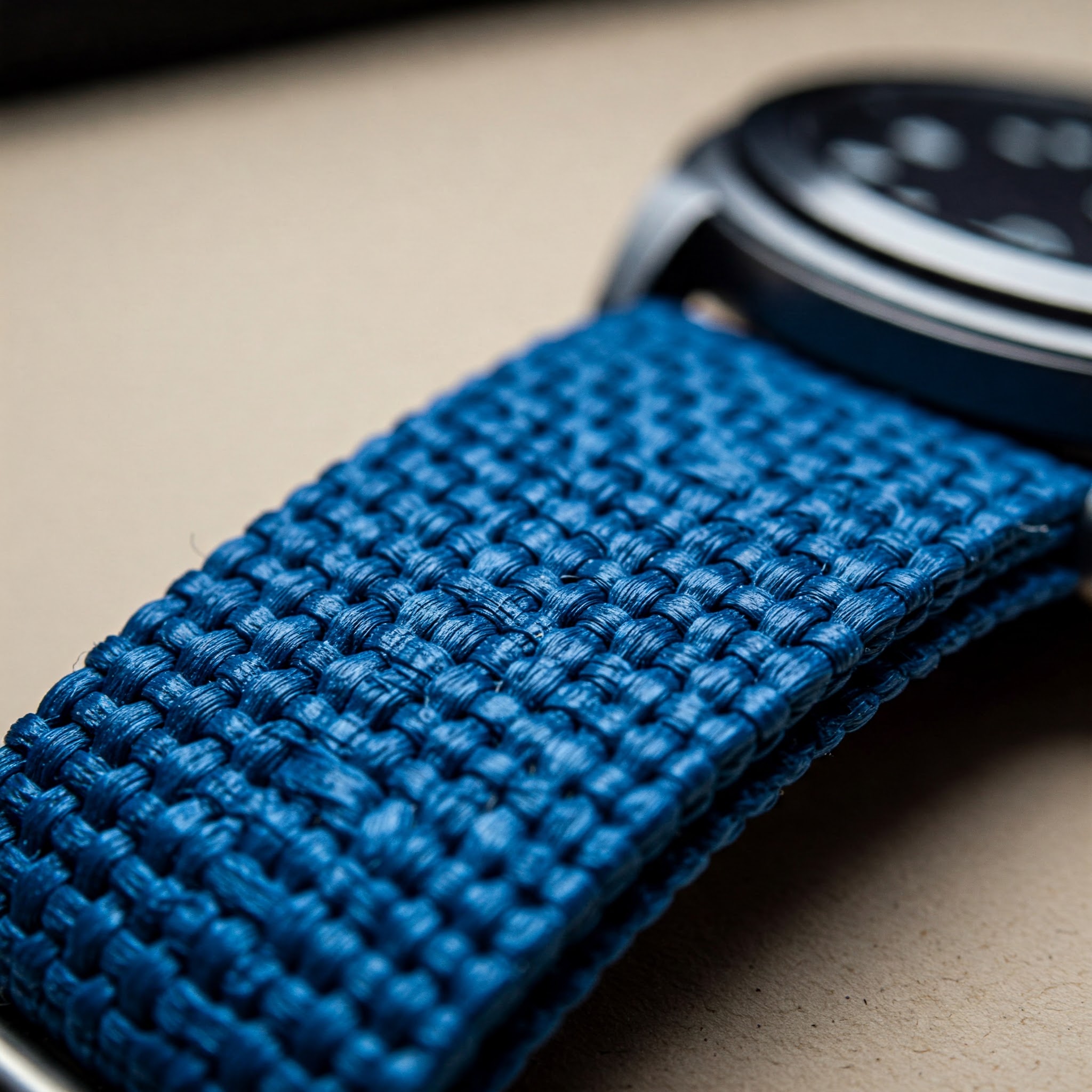"Close-up of a stylish blue perlon watch strap showing its woven texture."