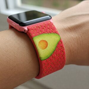 "A wrist wearing a comfortable and eye-catching strawberry avocado watch band."