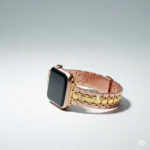 Stylized shot of a rose gold and gold Apple Watch band paired with a watch, demonstrating its fashionable appeal.