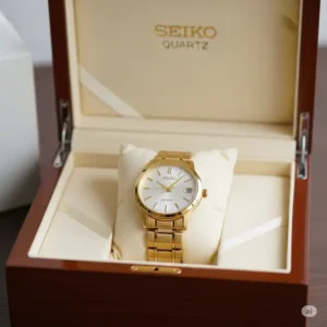 Close-up of the gold-tone bracelet of a seiko quartz gold watch, highlighting the quality craftsmanship and secure clasp mechanism.