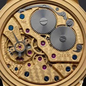 Close-up of the intricate mechanical movement inside a gold watch 14k gold.
