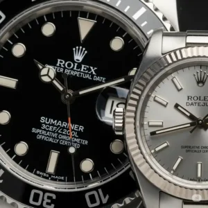 Close-up view of two distinct Rolex watch dials, a larger one for him and a smaller one for her, showcasing the harmonious design of his and hers Rolex watches.