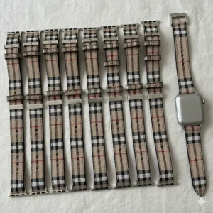 A detailed image of a high-quality, genuine leather Apple Watch Burberry strap, showing its unique design.
