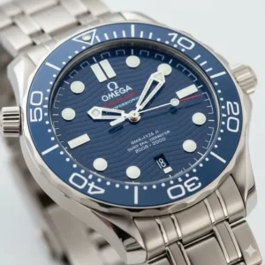 Detailed shot of the blue wavy dial and helium escape valve of the rolex submariner vs omega seamaster comparison focus watch, showcasing the Seamaster's unique features.
