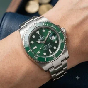 Close-up of a green-dial Rolex Submariner Hulk stainless steel watch highlighting its signature gold-dust sunburst finish as a top investment watches for 2026 option.